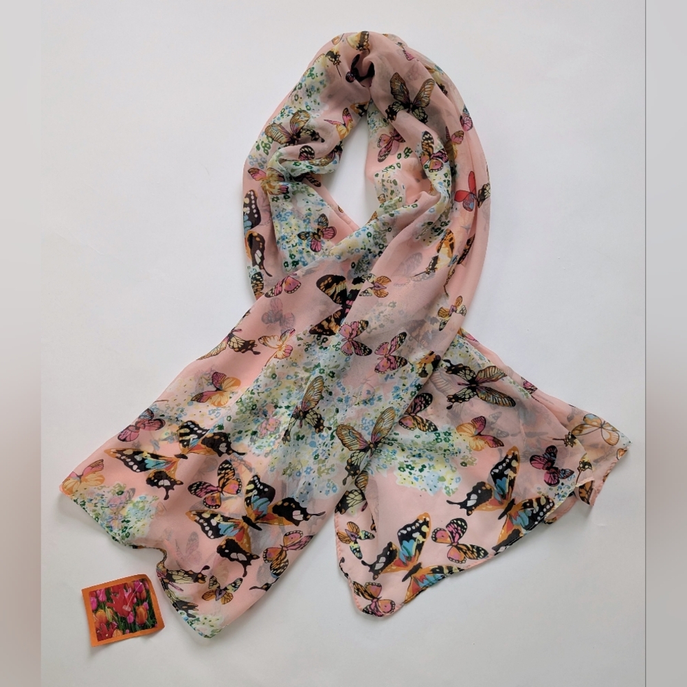 A Boutique Pink Scarf With A Butterfly Print